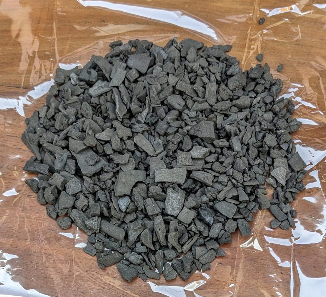 Charcoal granular spread on film rubber on the floor